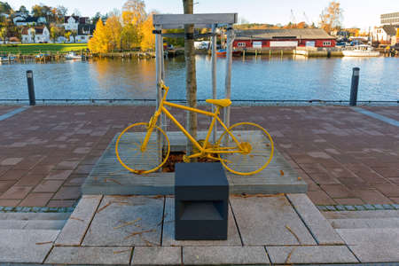 Painted Bright Yellow Bicycle in Fredristad Norwayの写真素材