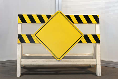 Construction Site Barrier With Yellow Warning Sign