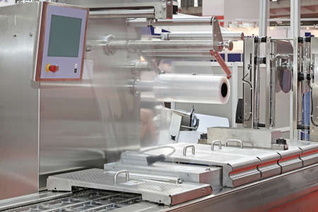 Foil Packing Machine at Production Line in Food Factory