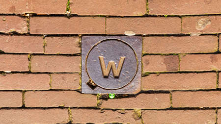 W Water Line Sign at Pavement Bricksの写真素材