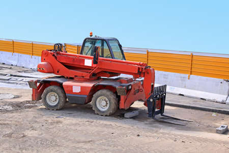 Big Forklift Truck With Long Boom at Construction Site