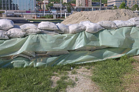 Wall of Sand Bags and Tarp for City Flood Protection