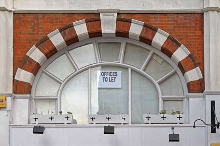 Offices To Let Sign in Building Window