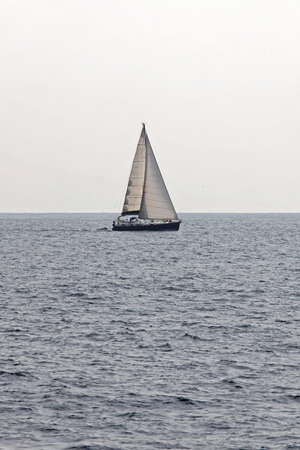 Small Sailboat Sailling at Meditteranean Sea Near Italy