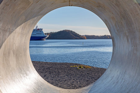 Looking Throgh Big Concrete Pipe Construction at Seaの写真素材