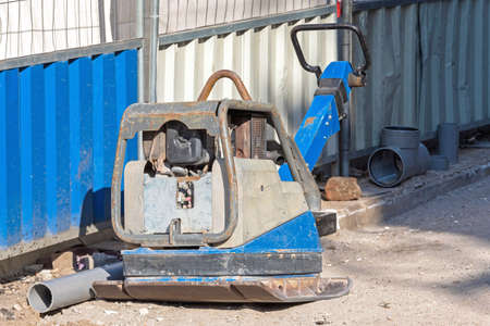 Vibratory Plate Compactor Machine at Street Construction Site