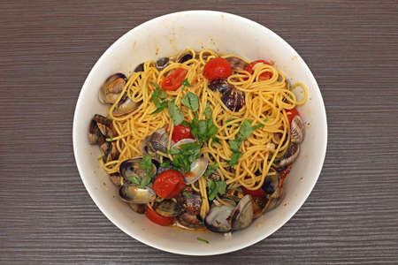 Spaghetti With Clams and Tomatoes Meal in Bowlの写真素材