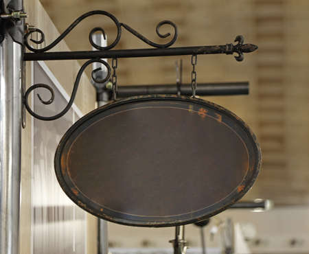 Vintage Style Brown Rust Metal Hanging Sign Boardの写真素材