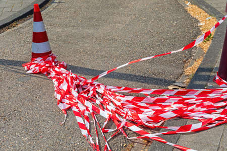 Many Strips of Red Safety Tape at Streetの写真素材