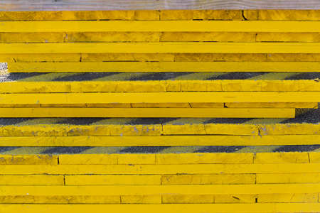 Vivid Yellow Paint at Wooden Plank Boardsの写真素材