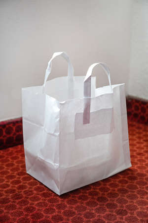Big White Paper Shopping Bag at Floorの写真素材
