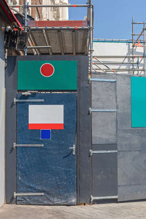 Entrance Door to Construction Site Scaffolding in Cityの写真素材