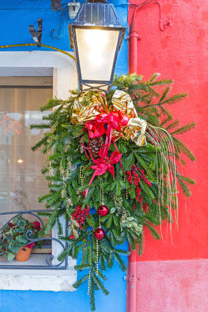 Evergreen Christmas Decoration in Front of House Buranoの写真素材
