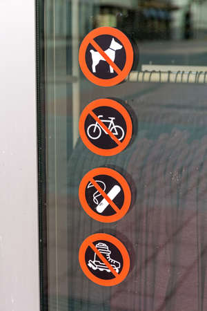 Four Restrictions Warning Signs at Glass Doorの写真素材