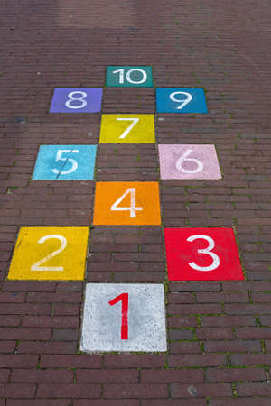 Colourful Hopscotch Playground Markings Numbers at Pavementの写真素材