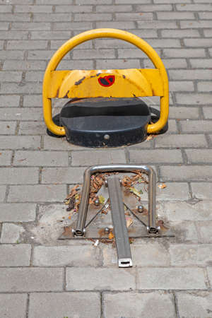 Parking Barrier Up at Street Pavementの写真素材