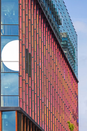 Red Glass Facade at Modern Building in Amsterdamのeditorial素材