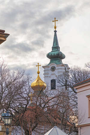 Church Tower With Gold Cross in Novi Sad Serbiaの写真素材
