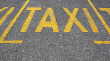 Yellow Taxi Sign Parking Spots at Streetの写真素材