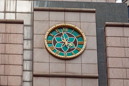 Green Clock With Golden Roman Numbers in Hong Kongの写真素材