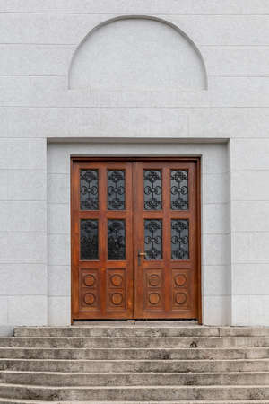 Double Wooden Door With Glass Decor and Stairway