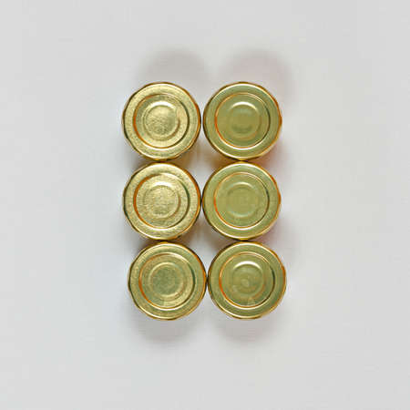 Six Small Jars With Golden Lids Top Viewの写真素材