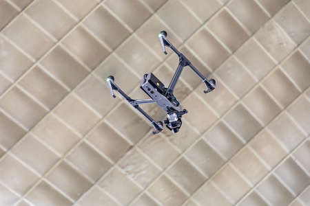 Big Carbon Quadrocopter Drone Fly in Hall