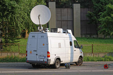 White Media Van With Satellite TV Broadcast Antennaの写真素材