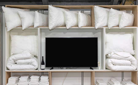 Many Pillows and Blankets in Tv Shelfの写真素材