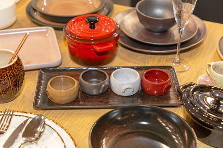 Contemporary Earthware Bowls and Plates at Table