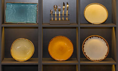 Many Colourful Dish Plates at Shelf Display