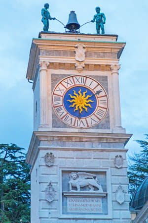 Clock Tower Landmark at Dusk in Udine Italyの写真素材