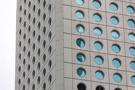 Modern Skyscraper Building With Many Round Windows in Hong Kong