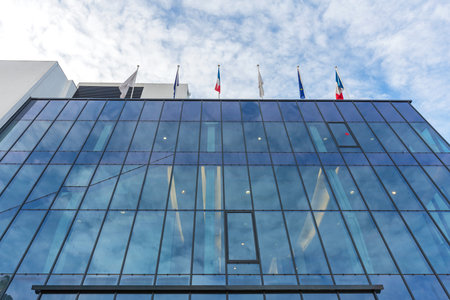 Flags at Top of Blue Glass Buildingのeditorial素材