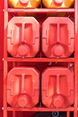 Big Red Plastic Canisters at Storage Rackの写真素材