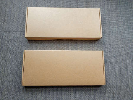 Two Long Cardboard Boxes Packages Closed