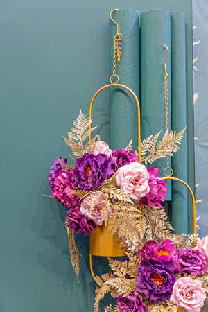 Artificial Flowers in Hanging Gold Pots Home Decorの写真素材