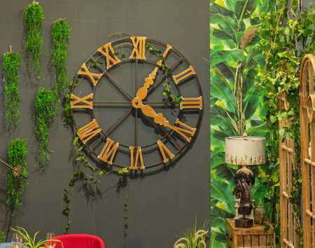 Big Round Roman Clock at Dark Wallの写真素材