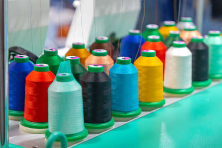 Many Colours Yarns Spools Bobbins at Sewing Machine