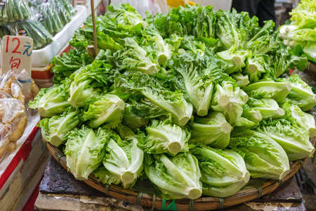 Big Bunch of Fresh Green Salad in Basketの写真素材