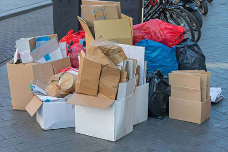 Carboard Boxes and Garbage Bags Trash at Street