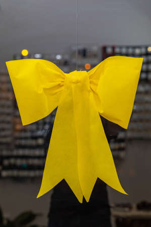 Big Yellow Bow Hanging at Glass Decoration