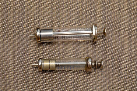 Two Big Old Reusable Glass Syringes Devicesの写真素材