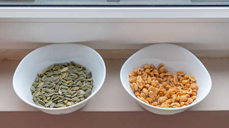 Peanuts and Pumpkin Seeds Healty Snacks in Bowls