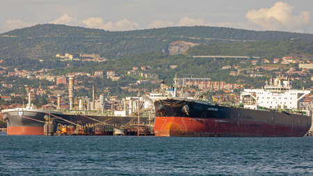 Trieste, Italy - June 17, 2019: Loading Oil Tanker Ship Amore Mio at Port Terminal in Trieste, Italy.のeditorial素材