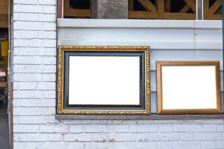Empty Space Gold Picture Frame at White Wall