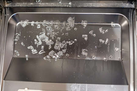 Broken Glass Pieces Shards in Dishwasher Machine Damage
