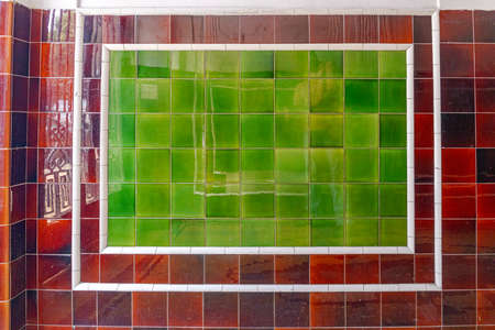 Green Glossy Ceramic Tiles at House Wall