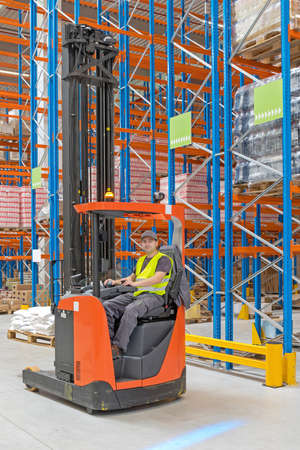 Forklift Driver in Distibution Warehouse Fulfilment Centerの写真素材