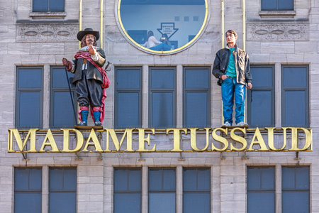Amsterdam, Netherlands - May 15, 2018: Madame Tussaud Museum Sign and Two Statues at Building in Amsterdam, Holland.のeditorial素材